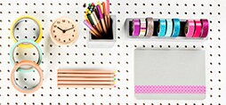 Scotch® Brand Tape and pencils on a peg board.