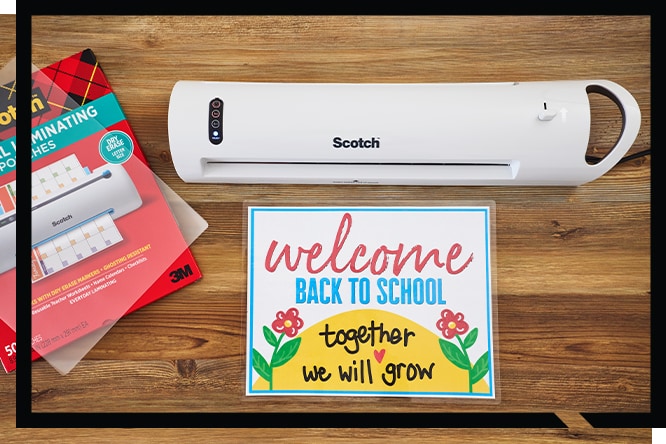 Hands using Scotch® Self Seal Laminating pouches to protect a family photo.
