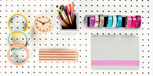 Decorative tape on desk with pencils and a mouse pad to the left and bottom/
