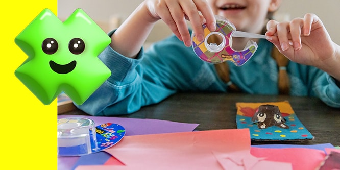 Child crafting with colorful paper and tape, alongside a cute green character with a smiley face on a yellow background.
