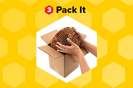 “Pack it” hands placing an object wrapped in Scotch™ Cushion Lock™ Expanding Paper Wrap in a cardboard box on a honeycomb patterned yellow background.
