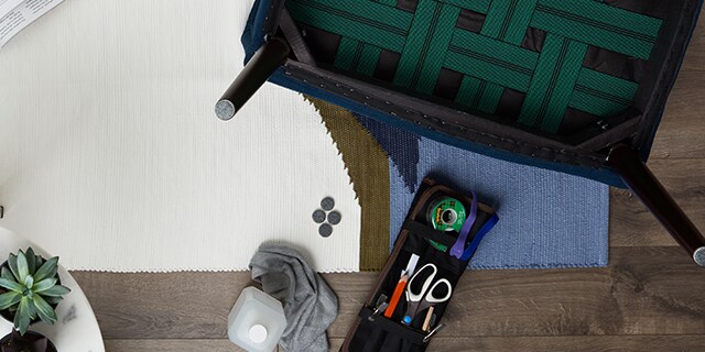 Felt patches being applied to the legs of a chair using Scotch™ Brand Products.
