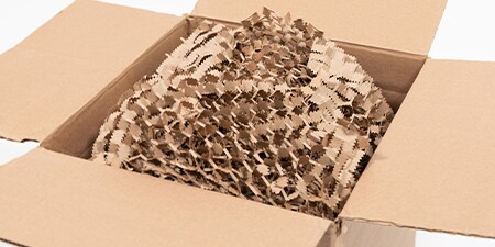 a cardboard box filled with Scotch™ Cushion Lock™ protective wrap
