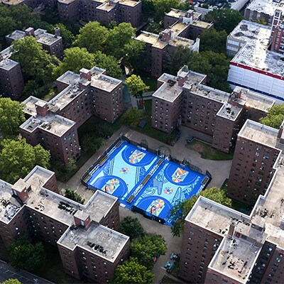 An overhead shot of the Project Backboard basketball courts in a shared community space in Brooklyn.