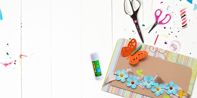 Scotch™ Brand Scissors and Glue, next to paper cutouts.
